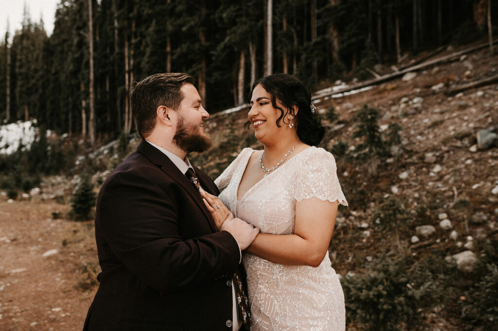 couple smiling looking at each other during their adventurous elopement