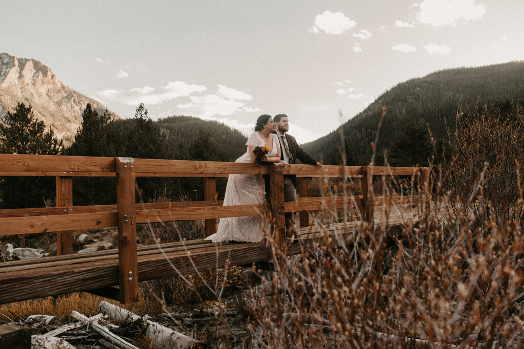 couple looking at the beauty of officers gulch during their adventurous elopement 