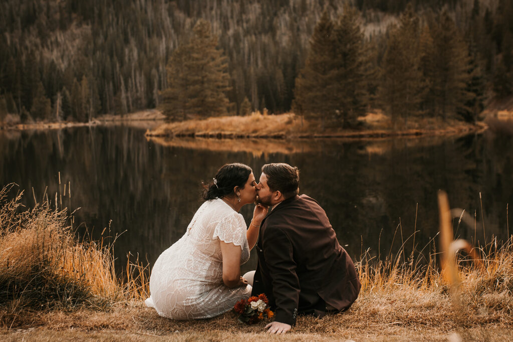 couple kissing at the beautiful officers gluch during their adventurous elopement in colorado 
