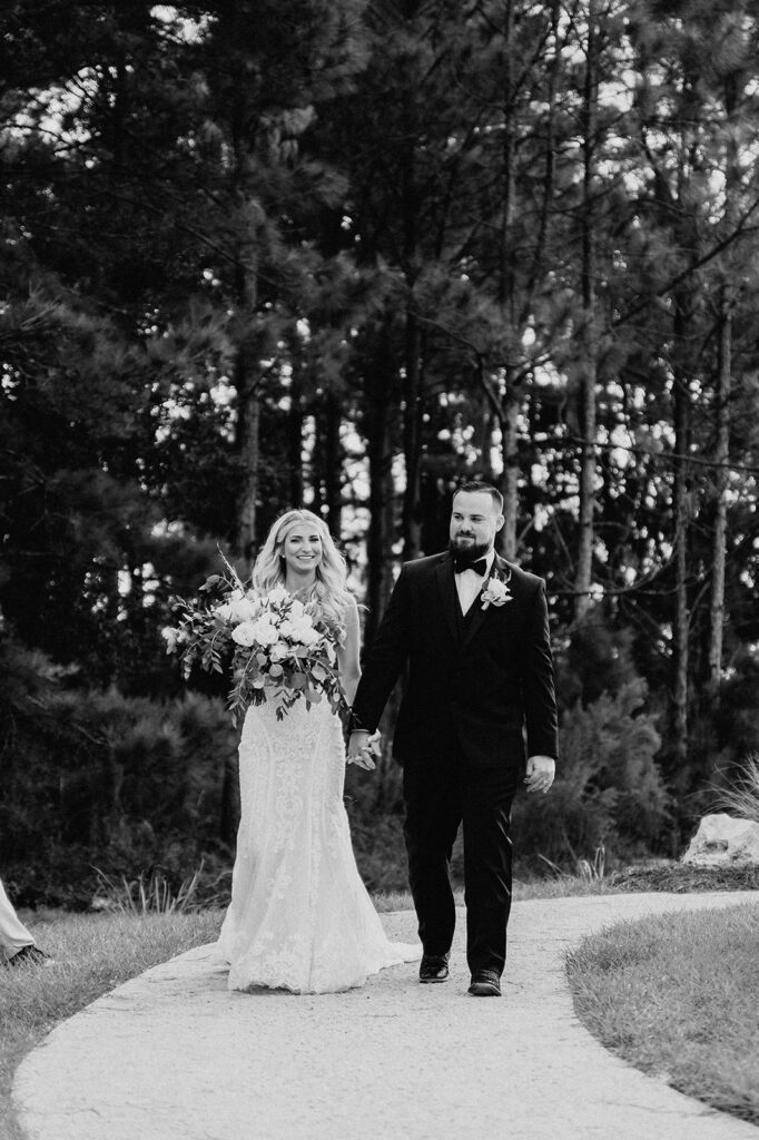 b&w photo of the couple leaving after their ceremony 