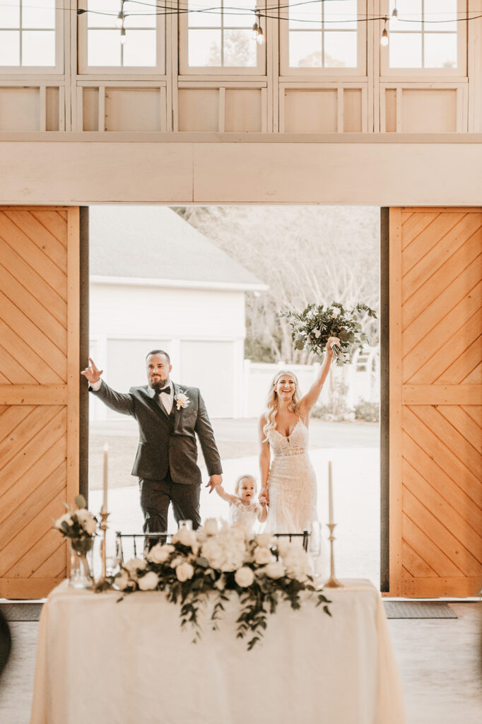 bride and groom entering their boho themed reception 