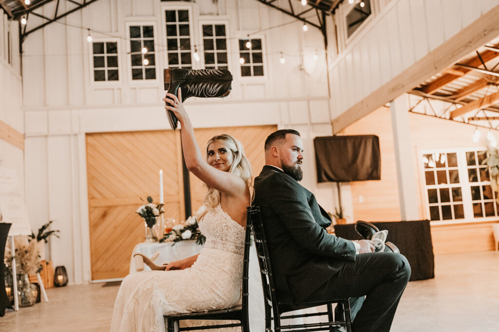 bride and groom playing games at their boho wedding day