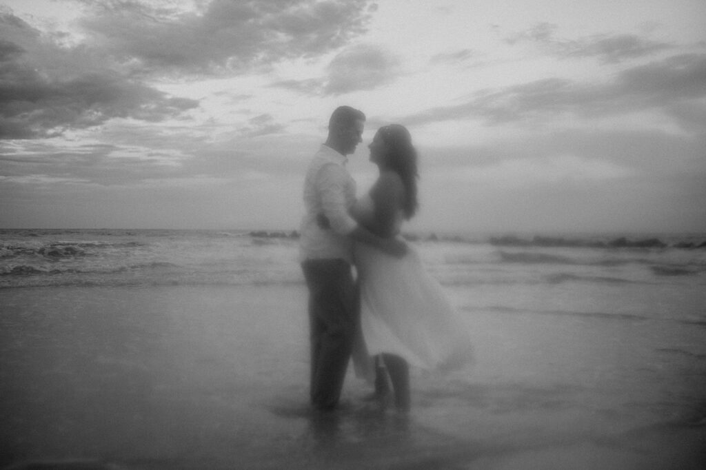 stunning couple at their moody engagement session in villano beach