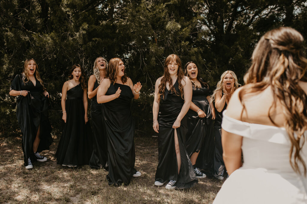 bride and her friends first look