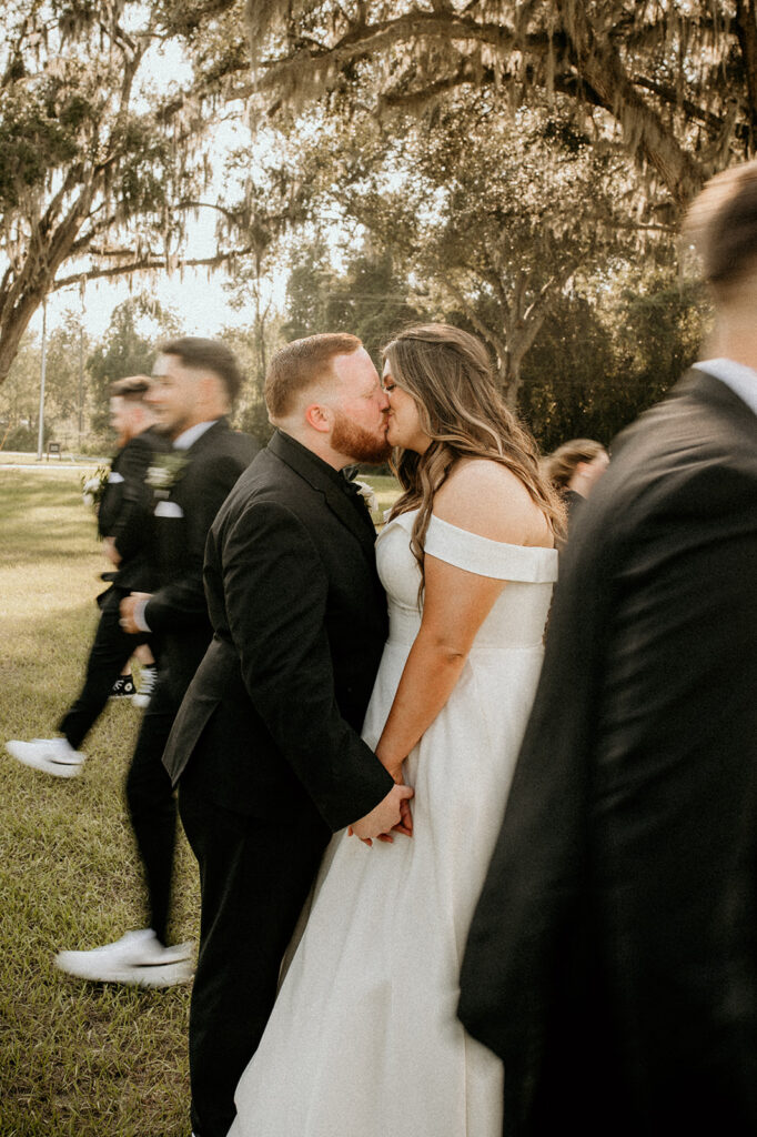couple kissing after their elegant wedding day