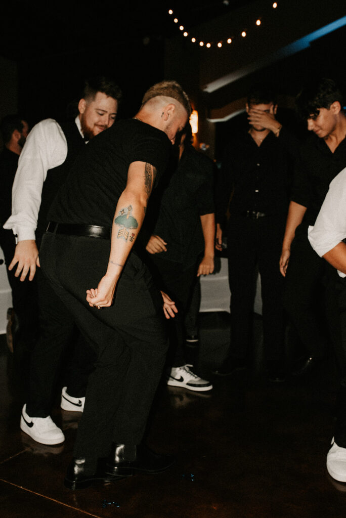 groom and his friends dancing 