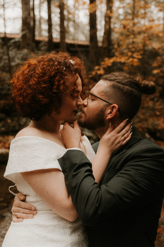 couple kissing during their fall elopement
