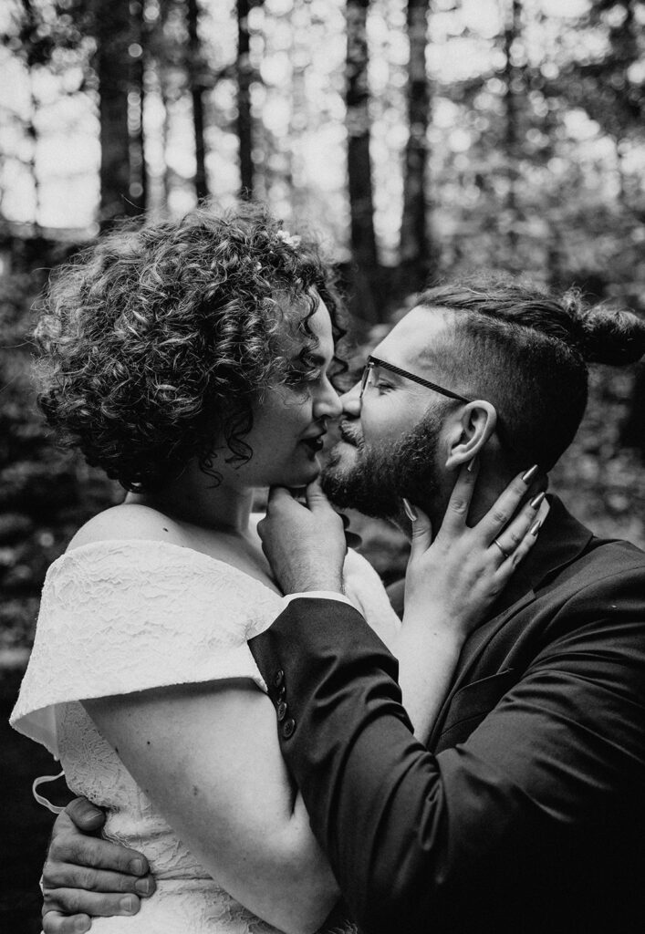b&w photo of the couple kissing