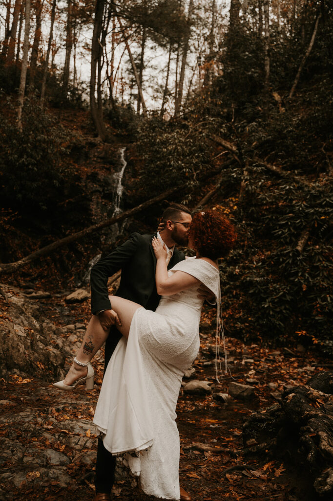 couple kissing at their fall elopement 