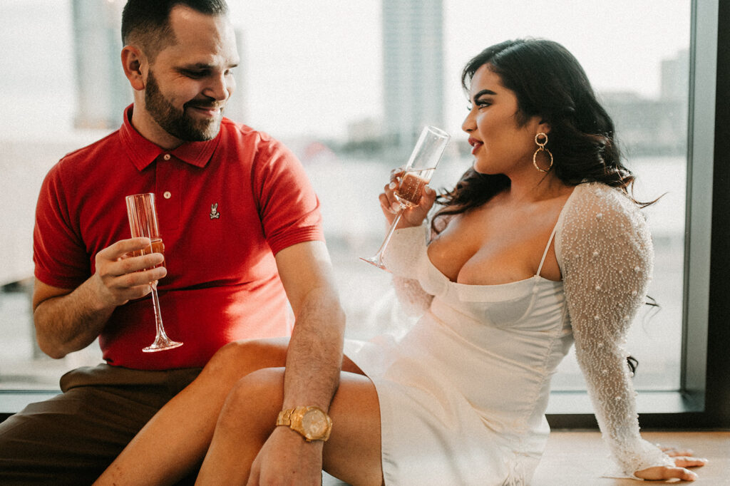 couple drinking champagne during their engagement session