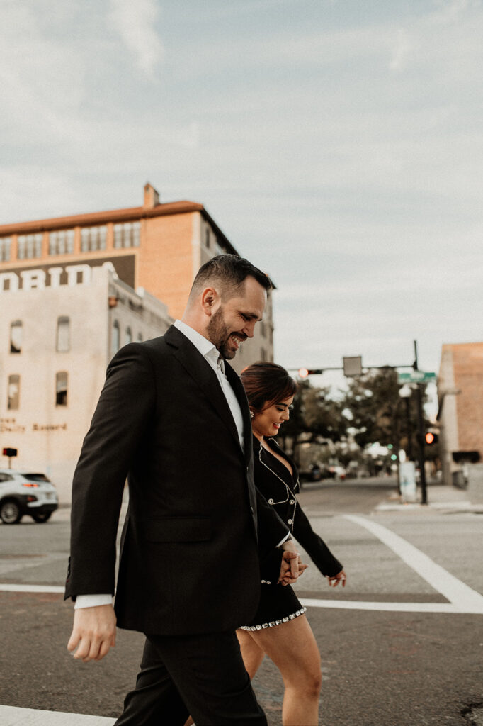 couple walking holding hands during their photoshoot 
