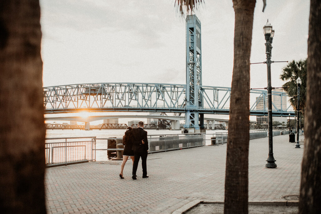 couple walking around downtown jacksonville during their timeless downtown engagement session