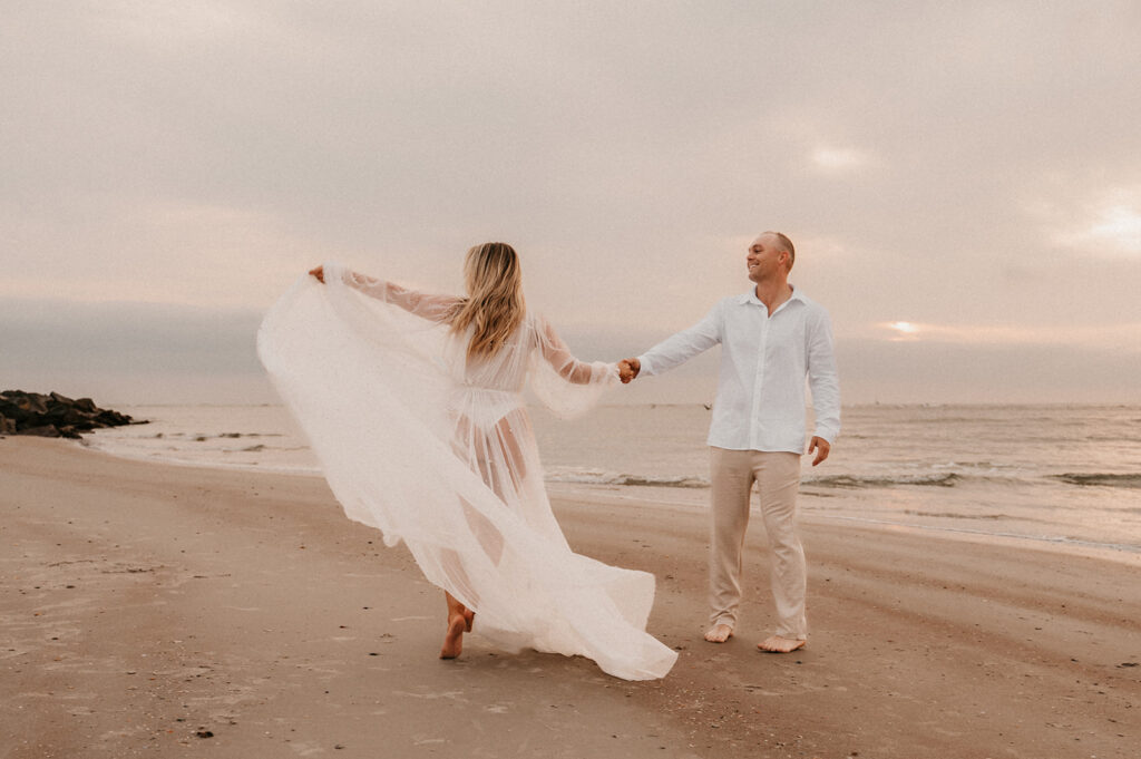 couple dancing during their romantic sunrise engagement session