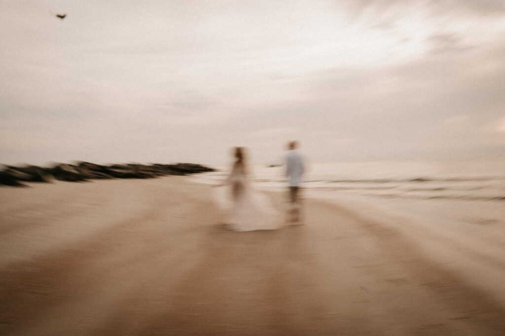 couple walking around vilano beach holding hands