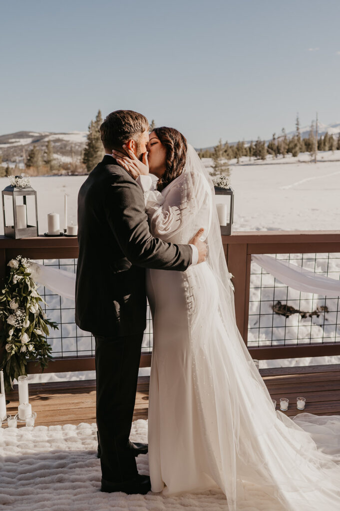 bride and groom kissing after their elopement ceremony