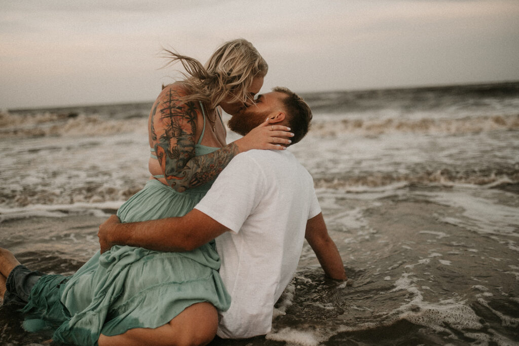 cute couple kissing at the beach