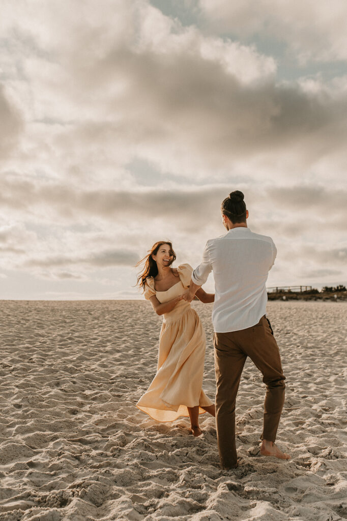 couple dancing at the beach 
