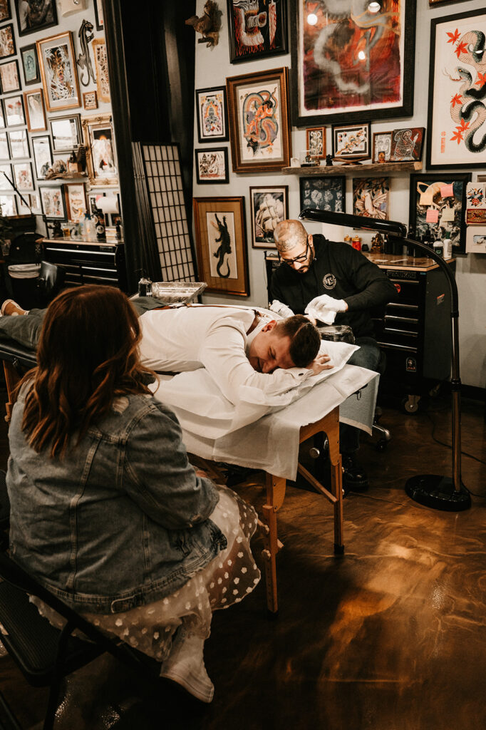 couple getting matching tattoos 