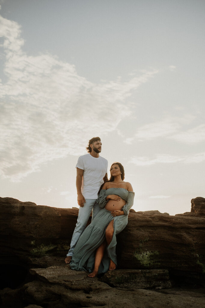 happy couple at their Beautiful Beach Maternity Session