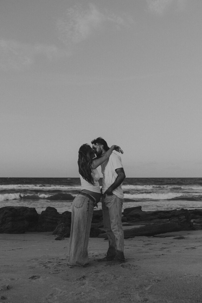 happy couple kissing during their  photoshoot