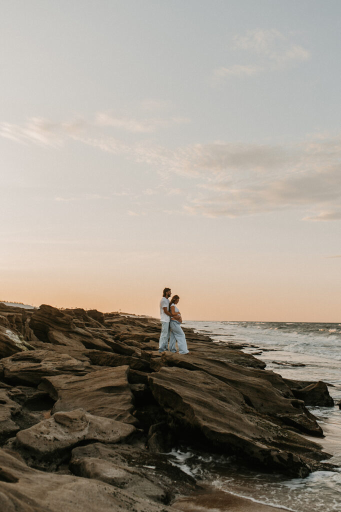 couple hugging during their maternity session