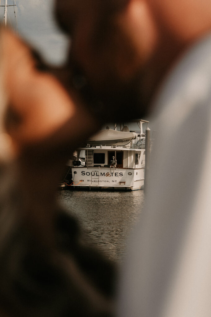 newly engaged couple kissing 