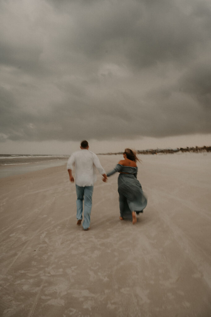 couple walking around the beach during their session