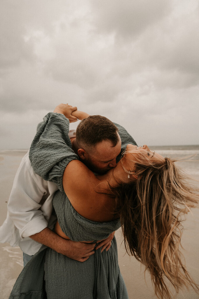 couple playing during their engagement photoshoot