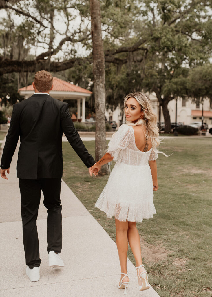 engaged couple walking around st. augustine