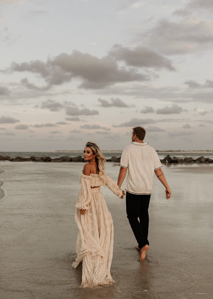 newly engaged couple walking around vilano beach