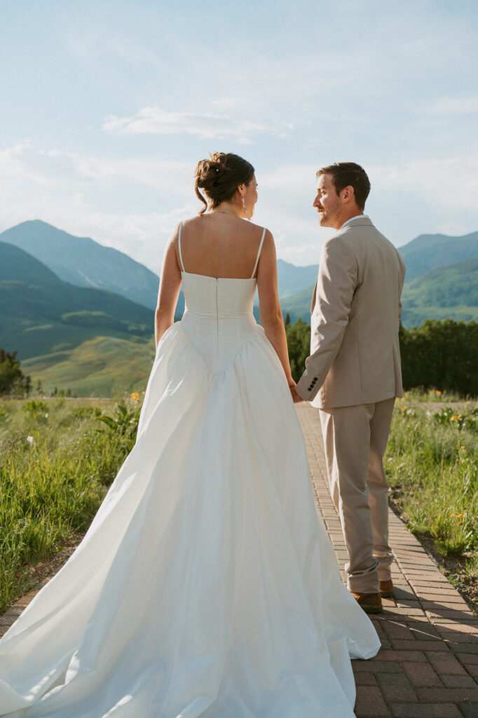 bride and groom smiling at each other