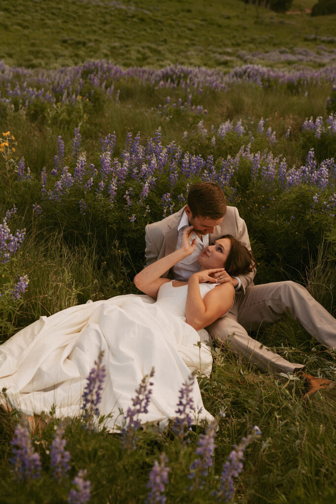 cute picture of the newlyweds at the wildflower field - perfect micro wedding venue