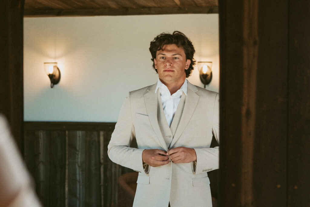 groom getting ready for his classy western wedding