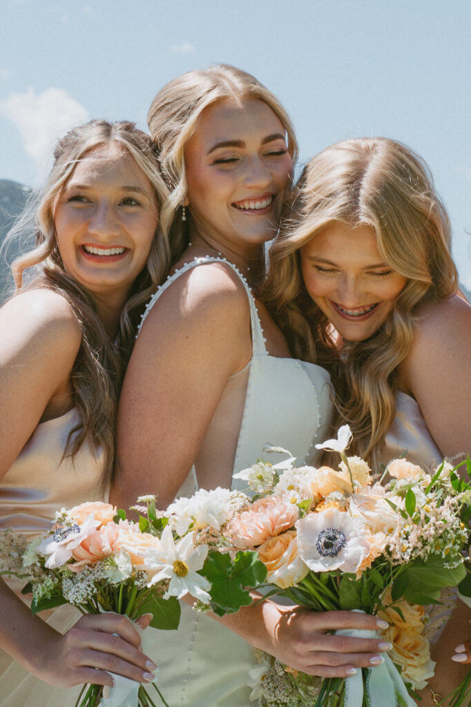 picture of the bride and her friends laughing 