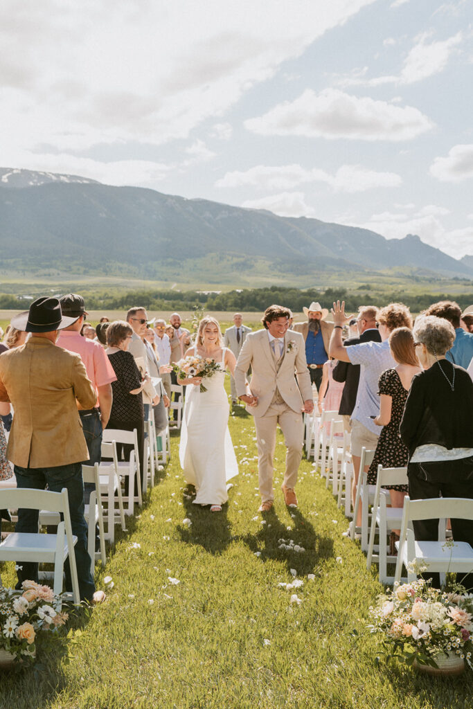 happy couple heading at their classy western wedding reception