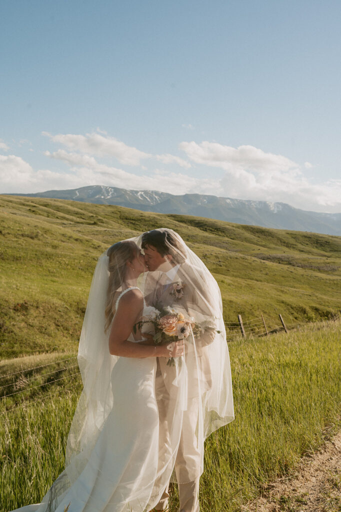 cute picture of the newlyweds kissing