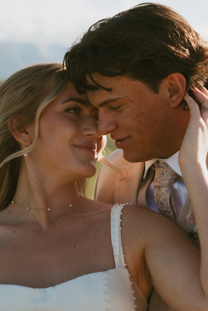 newlyweds looking at each other during their photoshoot at the classy western wedding