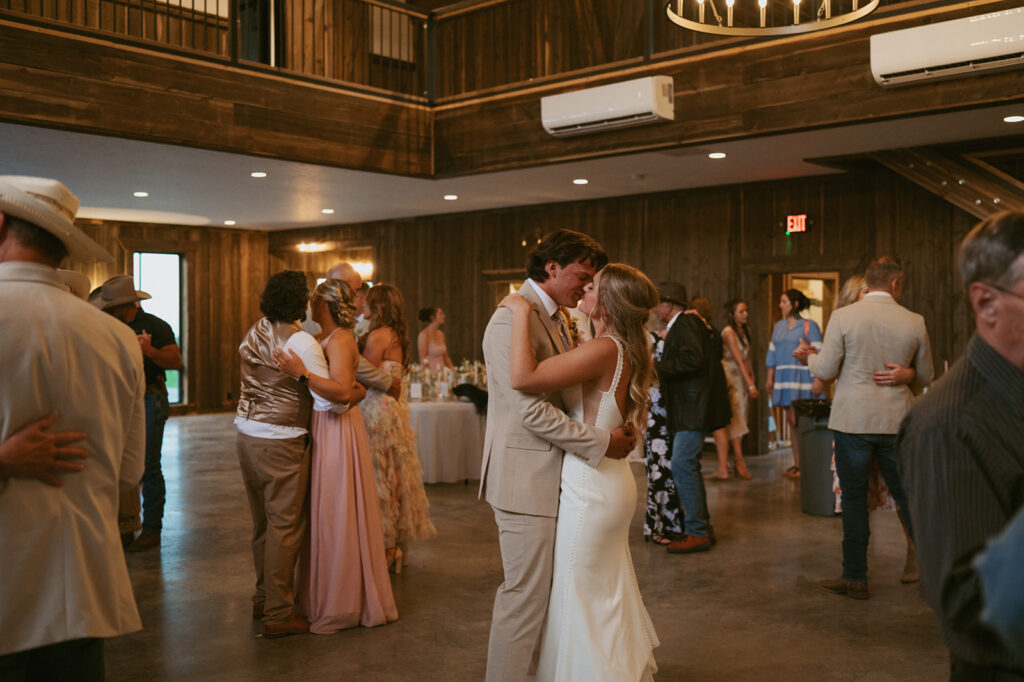 cute picture of the bride and groom dancing at their classy western wedding reception