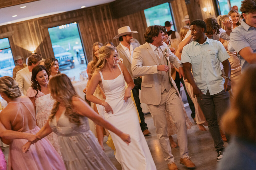 bride and groom dancing at their classy western wedding reception