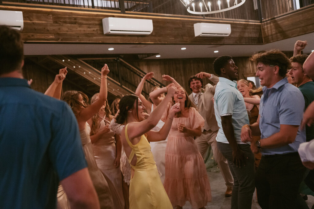 cute couple dancing with their wedding guests