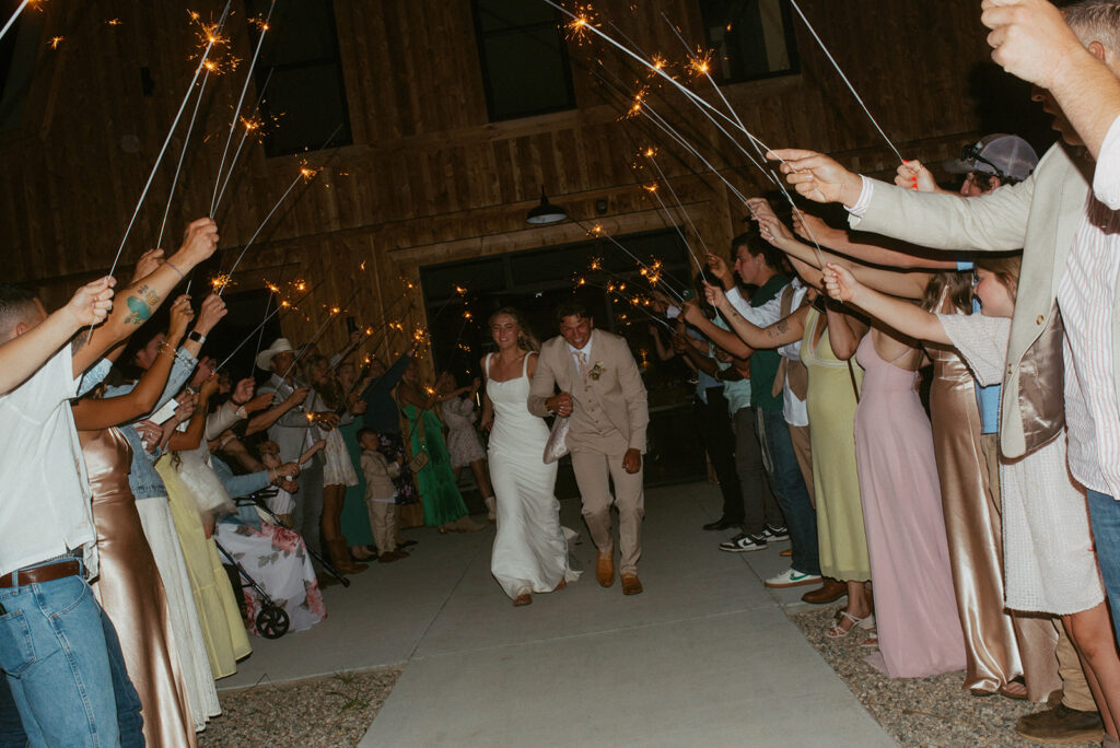 couple after their reception table 