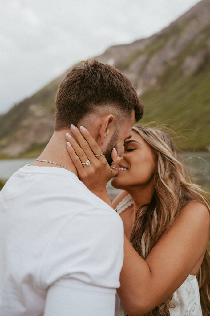 couple kissing at their proposal photoshoot 