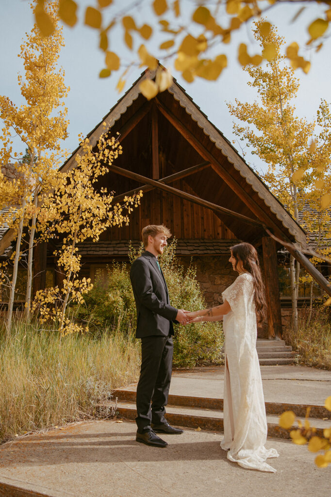 cute portrait of the bride and groom holding hands