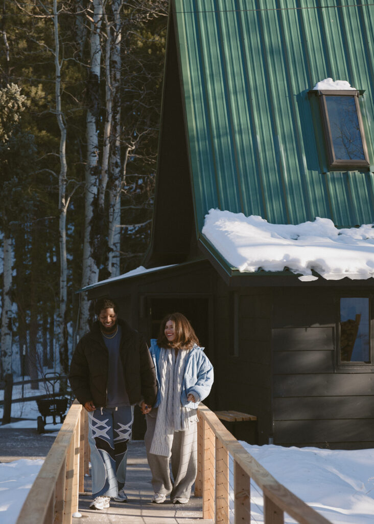 cute couple walking around their airbnb in colorado