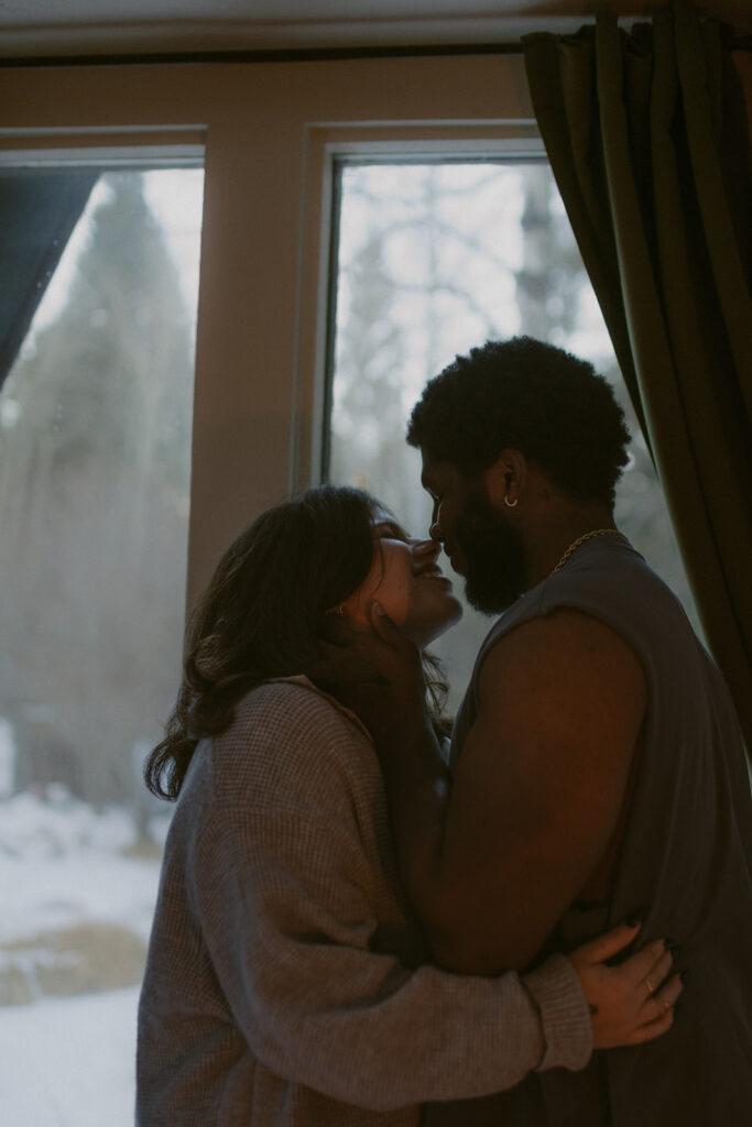 cute couple kissing at during their phootshoot