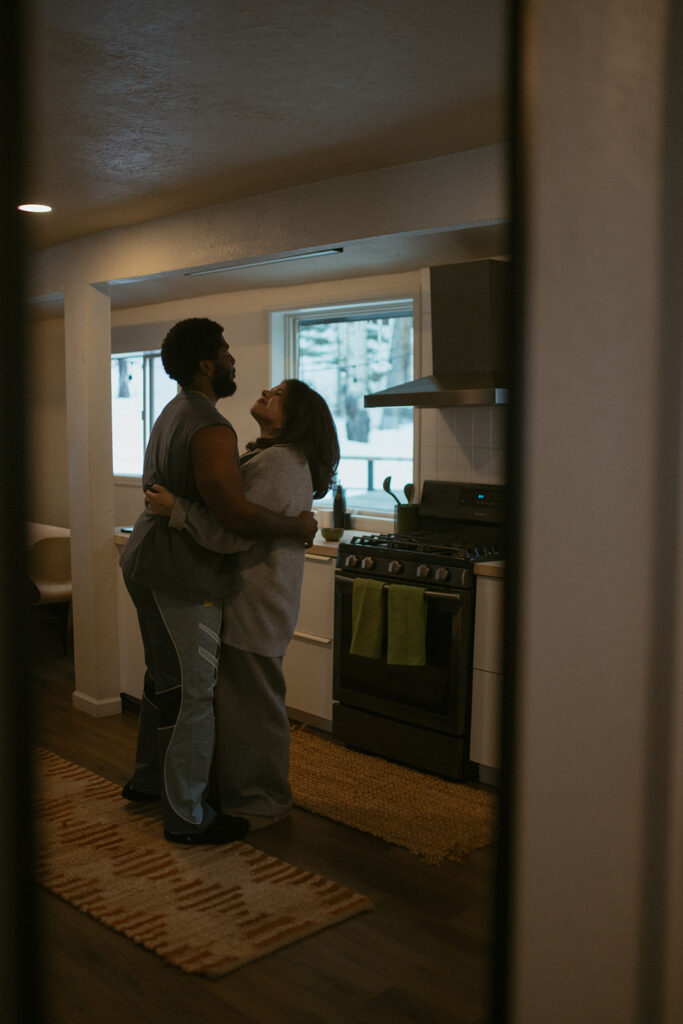 couple dancing in their airbnb during their session