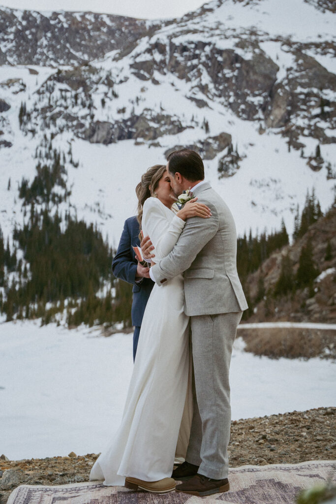 newlyweds kissing after their ceremony