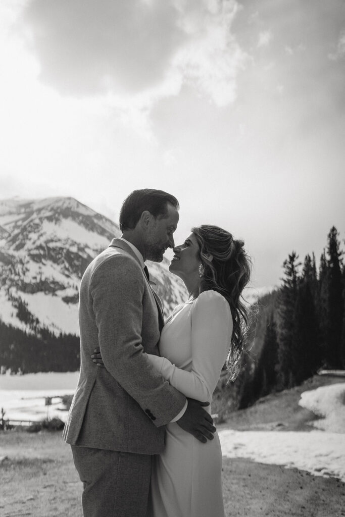 cute couple kissing during their bridal portraits 