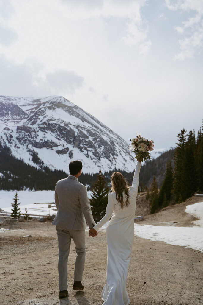 cute couple walking around their elopement location