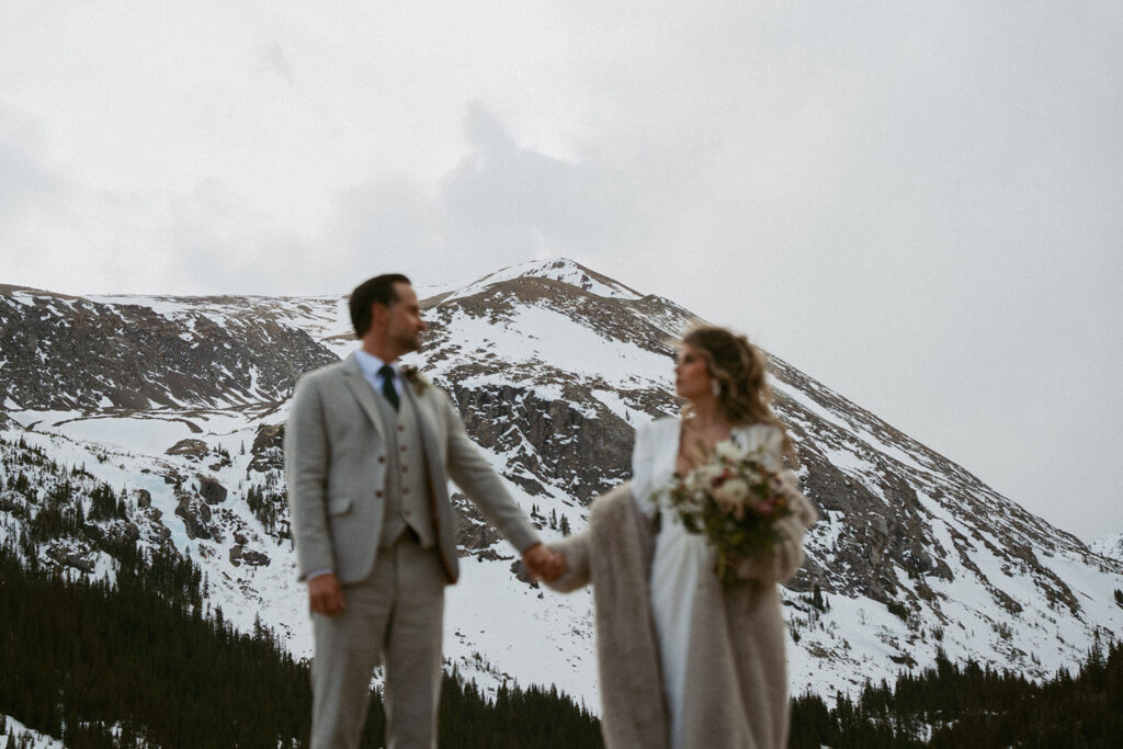 bride and groom holding hands during their session